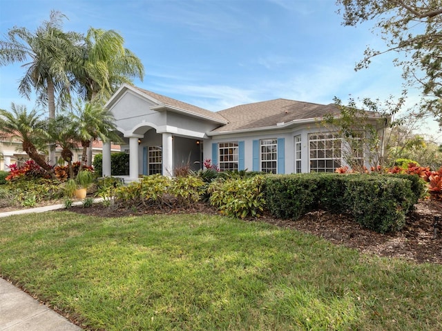 view of front of property with a front lawn