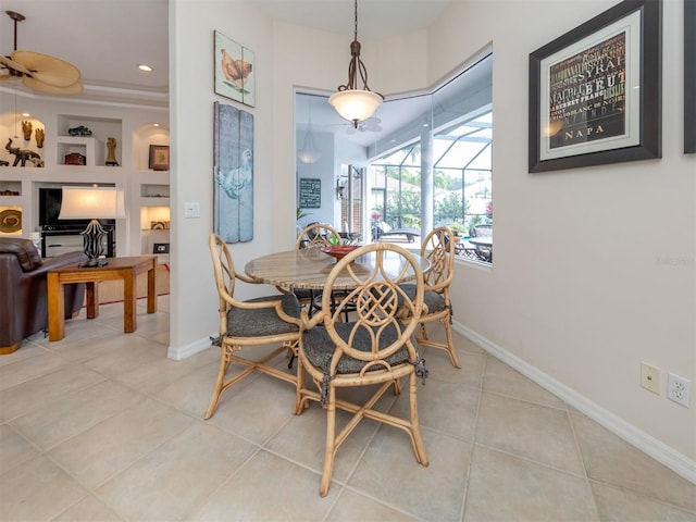 dining room featuring built in features and light tile patterned floors