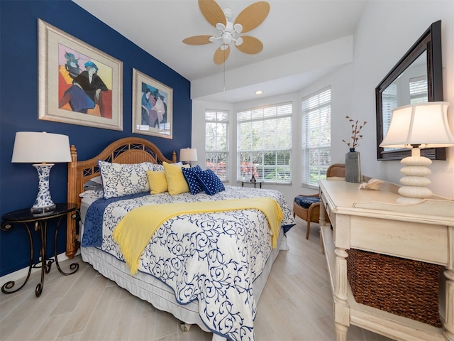 bedroom with ceiling fan and light hardwood / wood-style flooring