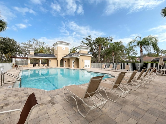 view of swimming pool with a patio