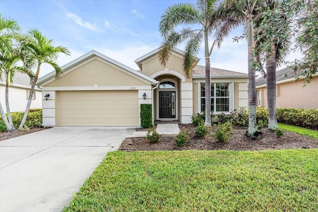 ranch-style home with a front yard and a garage