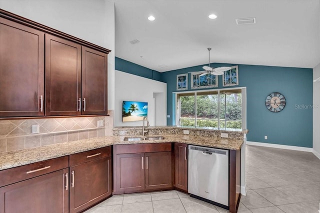 kitchen with dishwasher, light stone countertops, lofted ceiling, and sink