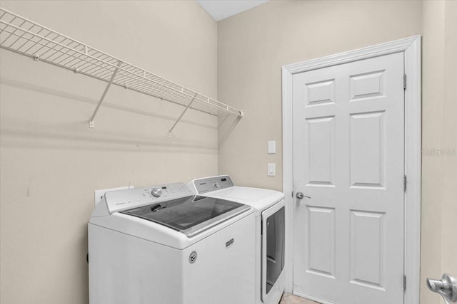 laundry area with washer and clothes dryer