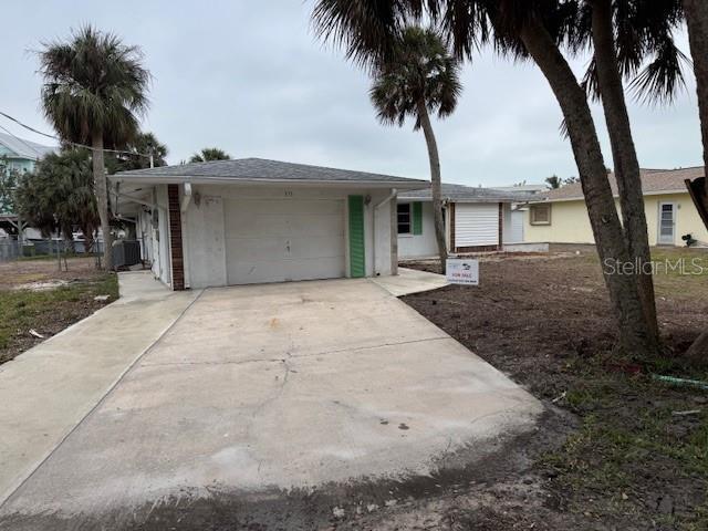 ranch-style house featuring a garage