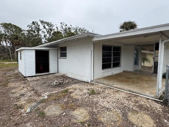 rear view of house featuring a patio