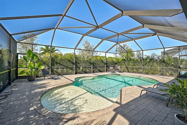 view of pool featuring a lanai and a patio area