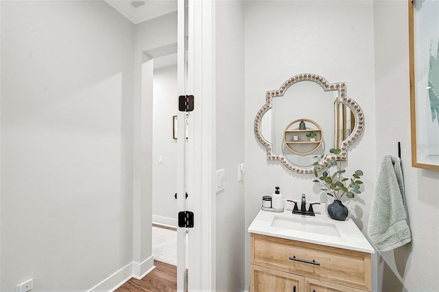 bathroom featuring vanity and hardwood / wood-style flooring