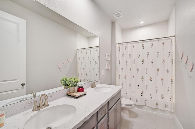 full bathroom featuring tile patterned floors, vanity, toilet, and shower / bathtub combination with curtain