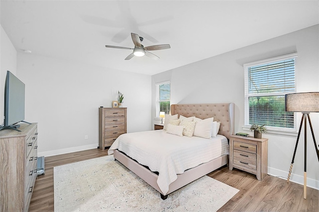 bedroom featuring ceiling fan and light hardwood / wood-style flooring