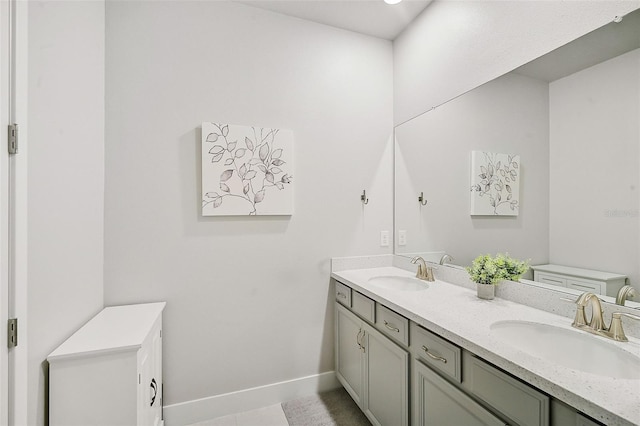 bathroom with tile patterned flooring and vanity