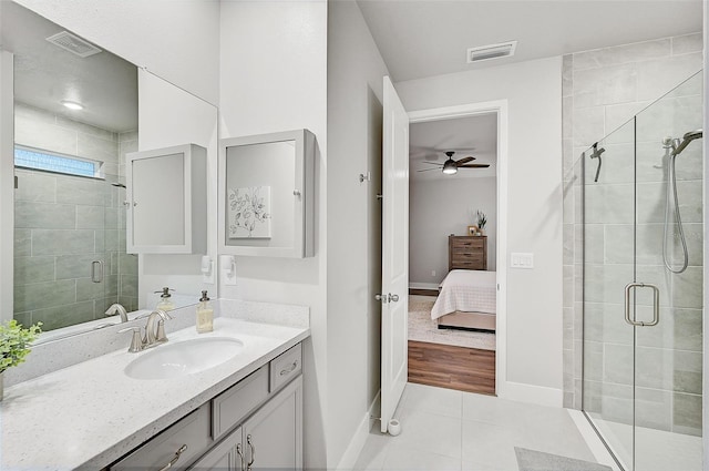 bathroom featuring ceiling fan, a shower with door, vanity, and hardwood / wood-style flooring