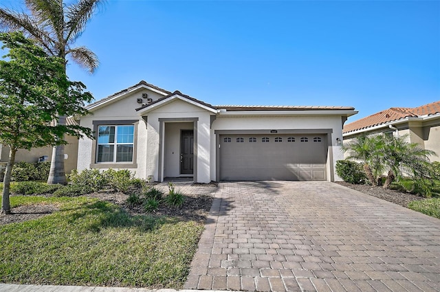 view of front of property with a garage