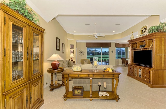 living room featuring light tile patterned floors, ceiling fan, and crown molding