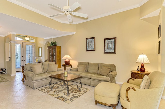 tiled living room featuring ceiling fan, crown molding, and french doors