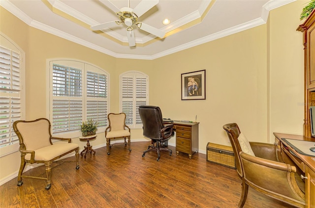 office space featuring dark hardwood / wood-style flooring, plenty of natural light, ornamental molding, and ceiling fan