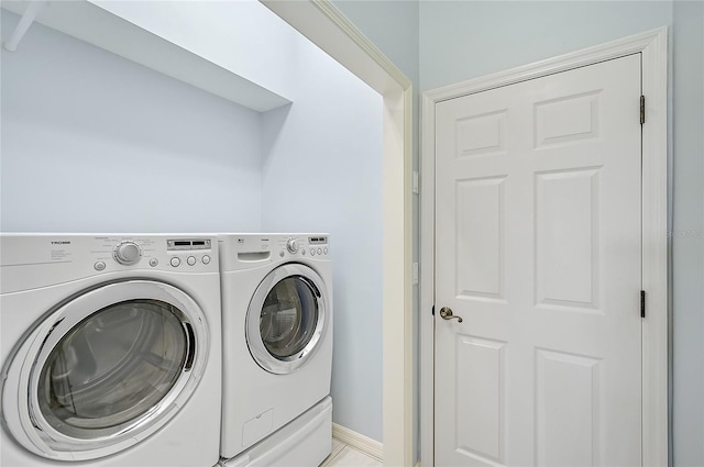 laundry room with independent washer and dryer