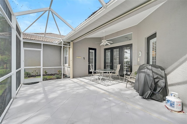 unfurnished sunroom with french doors and ceiling fan