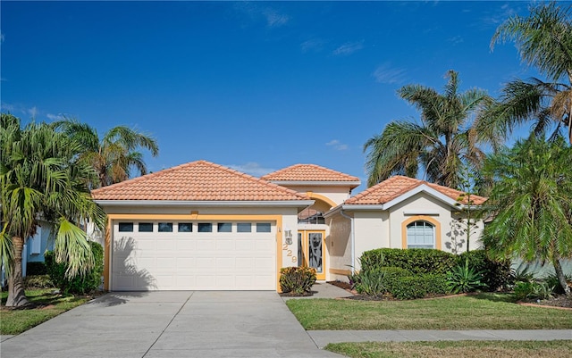 mediterranean / spanish-style home featuring a garage