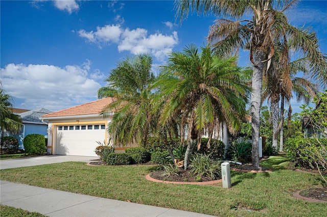 view of front of house with a front lawn and a garage