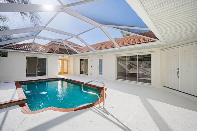 view of pool featuring a lanai and a patio area