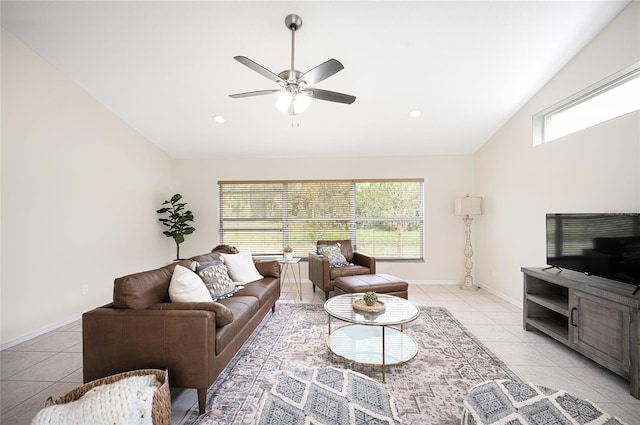 living room with vaulted ceiling, ceiling fan, and light tile patterned flooring