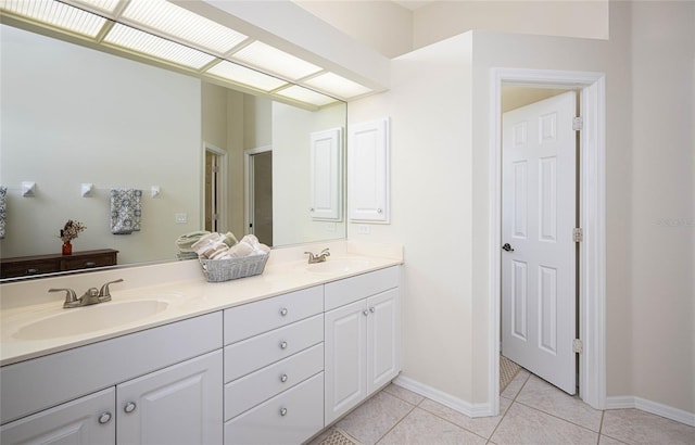 bathroom with tile patterned flooring and vanity