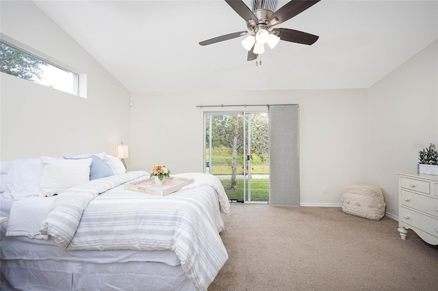 carpeted bedroom featuring access to exterior, multiple windows, lofted ceiling, and ceiling fan