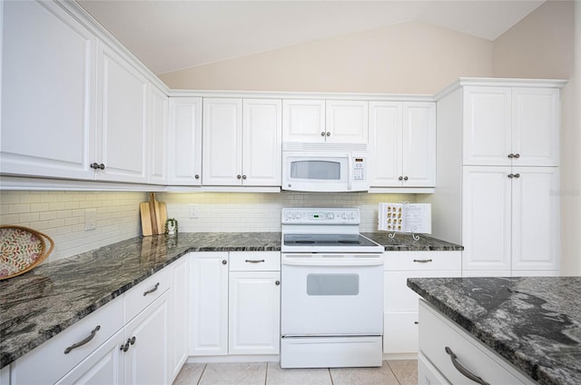 kitchen featuring vaulted ceiling, white cabinets, and white appliances