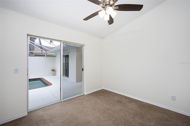 unfurnished bedroom featuring ceiling fan, vaulted ceiling, carpet floors, and a closet