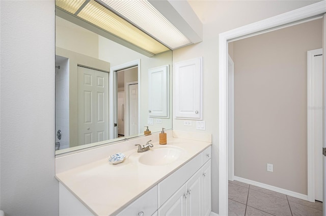 bathroom featuring tile patterned flooring and vanity