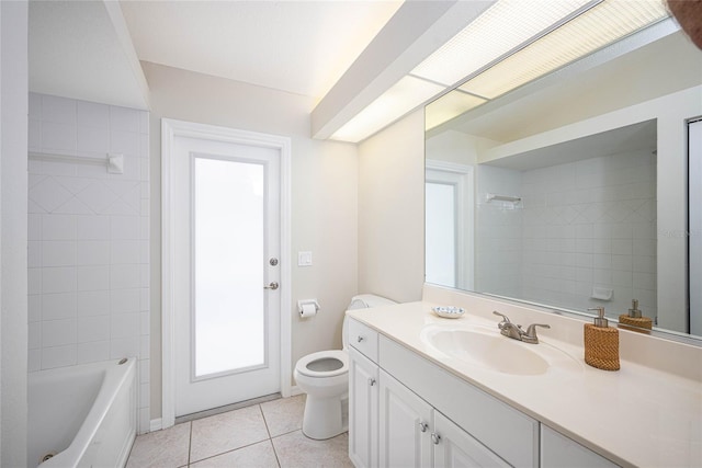 full bathroom with tile patterned floors, vanity, toilet, and tiled shower / bath combo