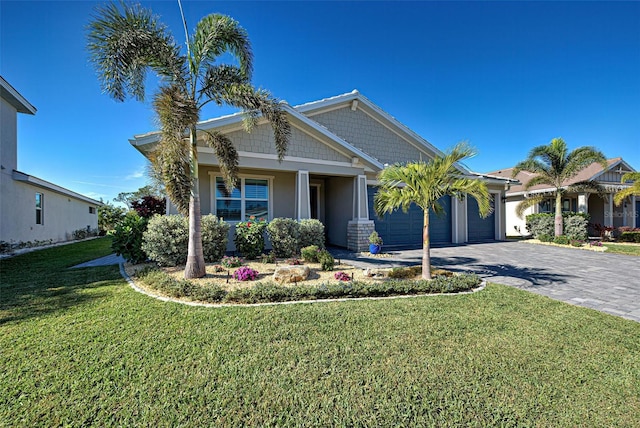 view of front of home featuring a garage and a front yard