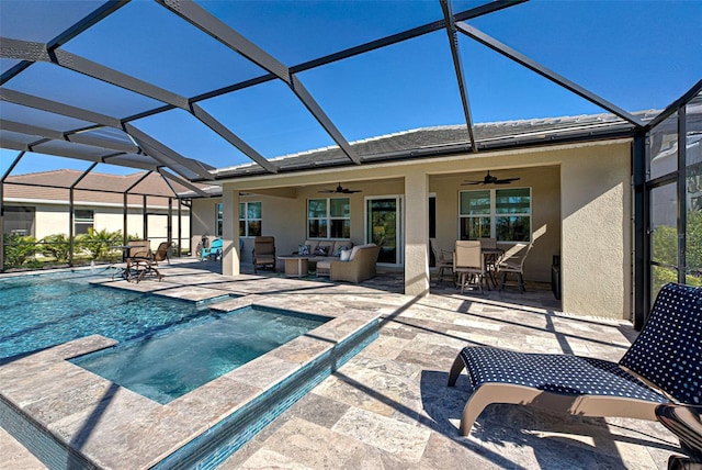 view of swimming pool with a patio area, outdoor lounge area, ceiling fan, and glass enclosure