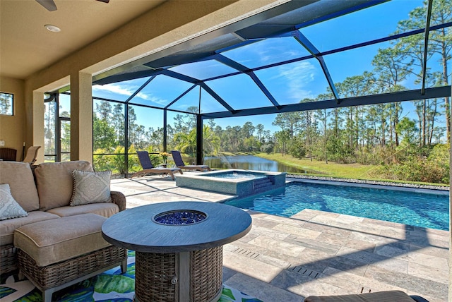 view of pool featuring an in ground hot tub, a water view, a patio area, and a lanai