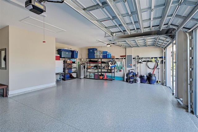 garage featuring a garage door opener and electric panel