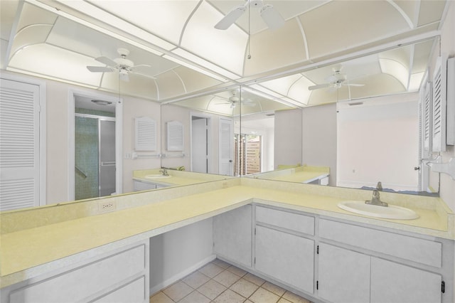 6906 Woodwind Dr Unit 12, Sarasota, FL 34231 - bathroom featuring ceiling fan, a stall shower, tile patterned floors, and vanity