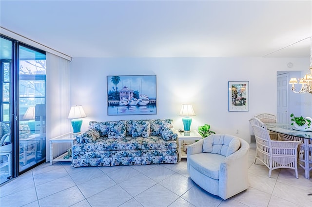 tiled living room featuring an inviting chandelier