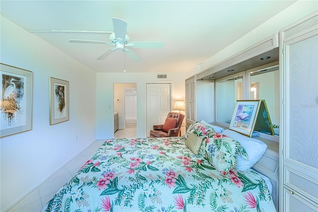 612 Bird Bay Dr S Unit 114, Venice, FL 34285 - bedroom featuring light tile patterned flooring, a ceiling fan, and baseboards