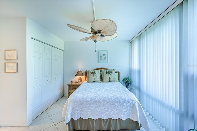 612 Bird Bay Dr S Unit 114, Venice, FL 34285 - bedroom with a closet, light tile patterned floors, ceiling fan, and baseboards