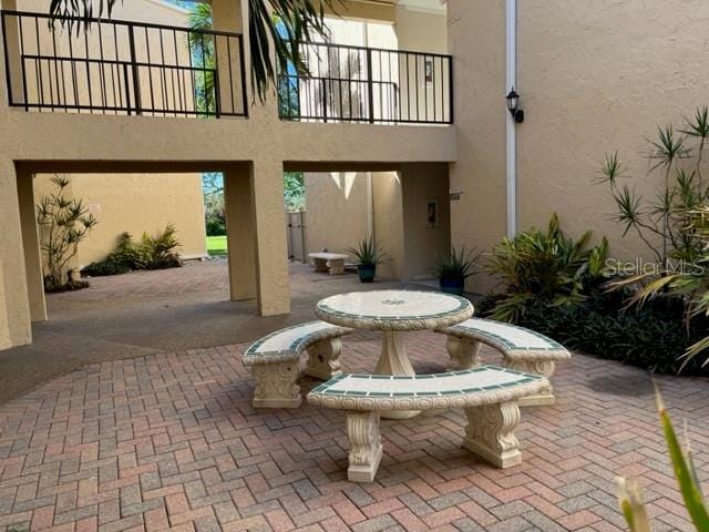 612 Bird Bay Dr S Unit 114, Venice, FL 34285 - view of patio / terrace with a balcony