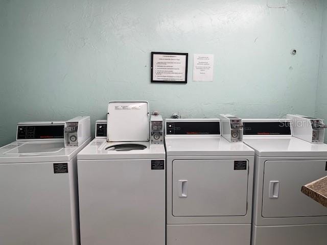 612 Bird Bay Dr S Unit 114, Venice, FL 34285 - shared laundry featuring washer and dryer