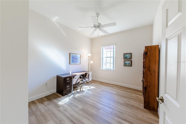 office area with ceiling fan and light hardwood / wood-style floors