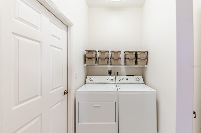 clothes washing area featuring washing machine and dryer