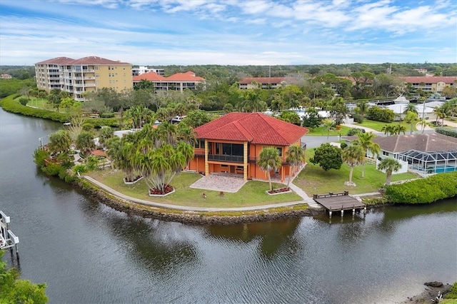 birds eye view of property featuring a water view