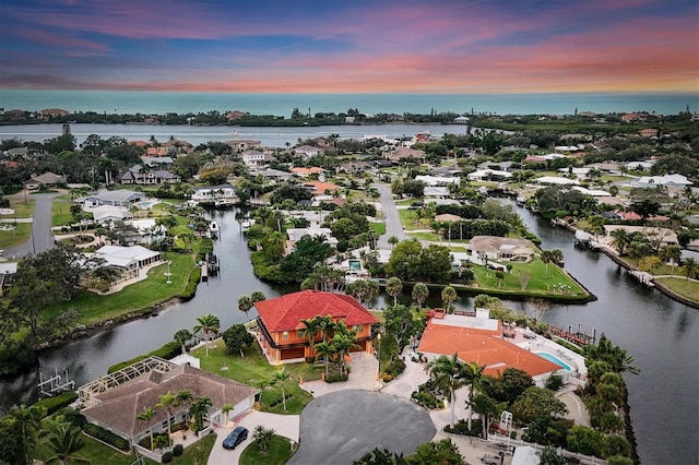 aerial view at dusk with a water view