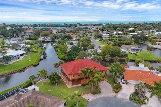 birds eye view of property featuring a water view