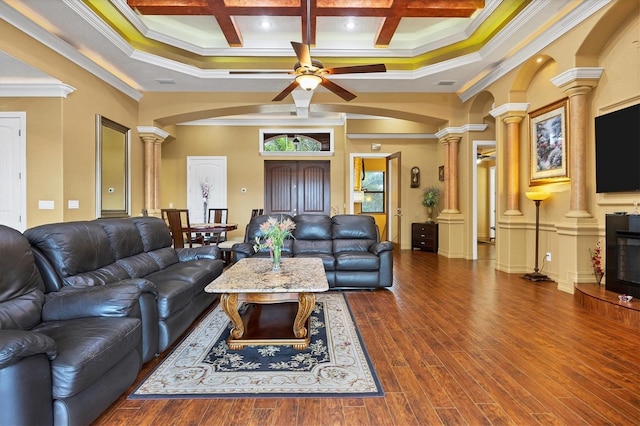 living room featuring beam ceiling, wood-type flooring, coffered ceiling, and ornamental molding