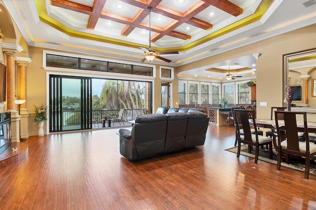 living room featuring ornamental molding, hardwood / wood-style flooring, and coffered ceiling