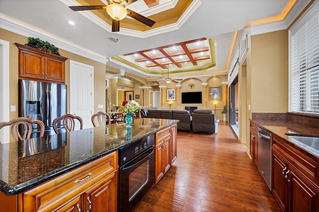 kitchen featuring a center island, coffered ceiling, crown molding, appliances with stainless steel finishes, and dark hardwood / wood-style flooring