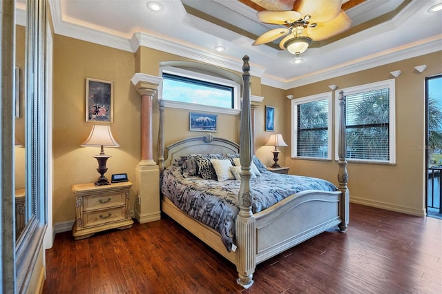 bedroom with multiple windows, ceiling fan, dark hardwood / wood-style floors, and ornamental molding